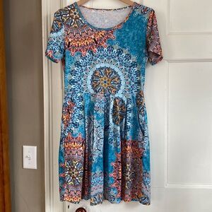 Cute print knit dress with pockets, size medium.